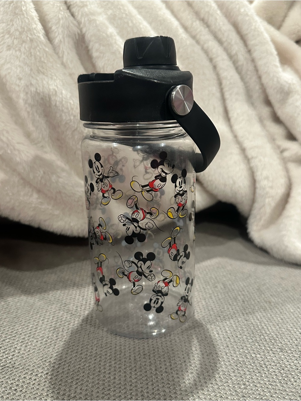 Disney Clear Mickey Mouse Water Bottle with Black Lid and Red-Yellow Accents